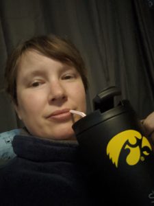 Amanda at home with Iowa Hawkeye mug