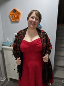 Gratuitious picture of me in a red, low cut dress showing off my tatas.