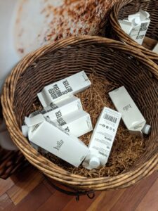 Boxes of water that look like little tall milk cartons. They say, "Boxed Water is Better."